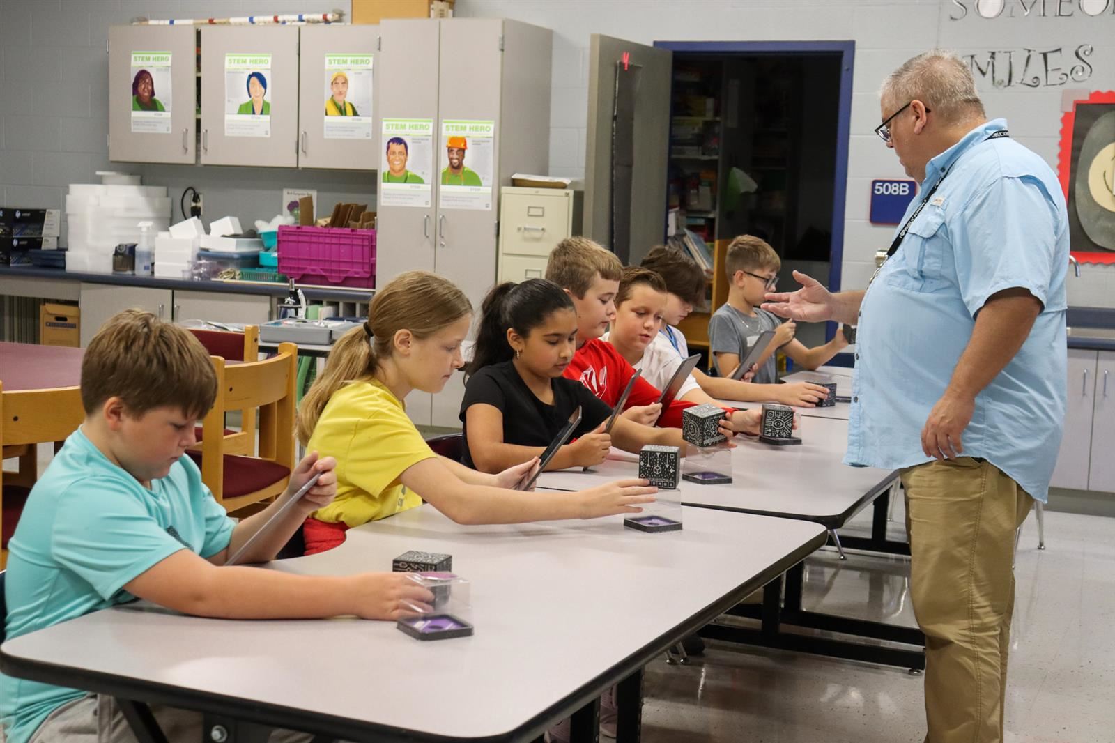students with robots and ipads